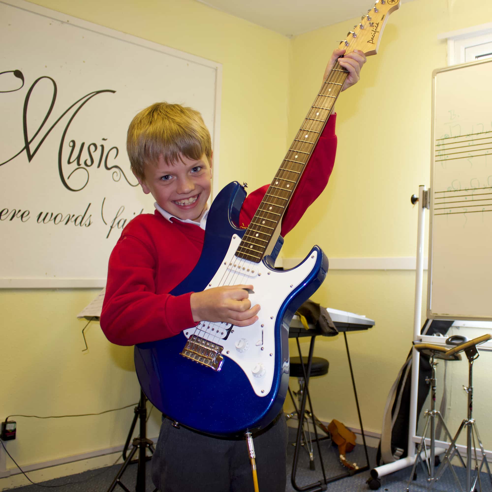 Child learning in The music works Guitar Lessons in Haslemere